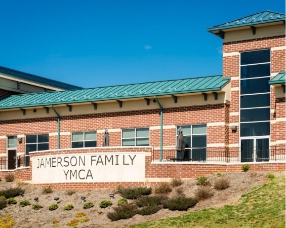 a brick building with a sign on the side