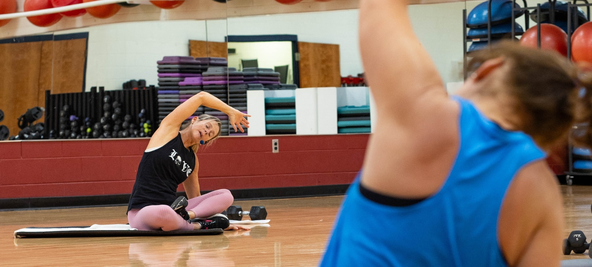 a woman stretching her arms doing yoga