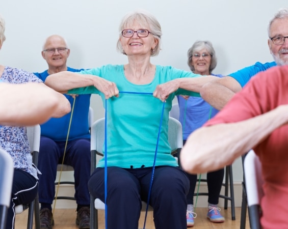 a group of elderly people exercising