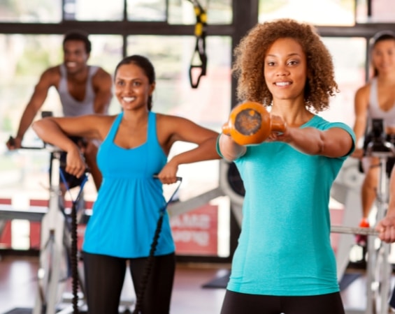 a group of people working out in a gym