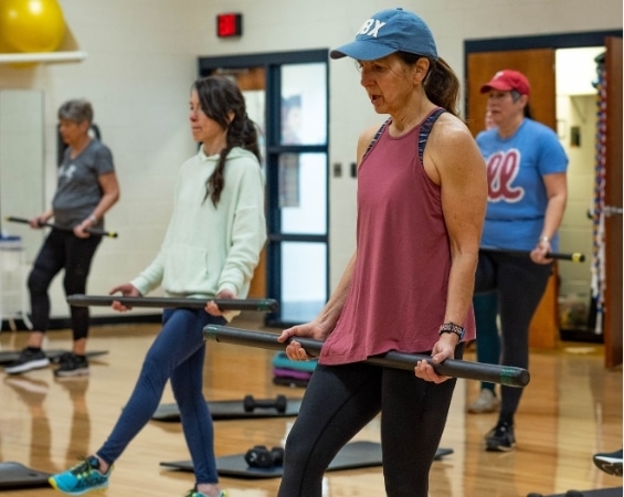 a group of people working out in a gym