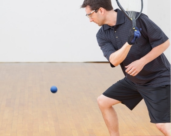 a man playing tennis with a racket