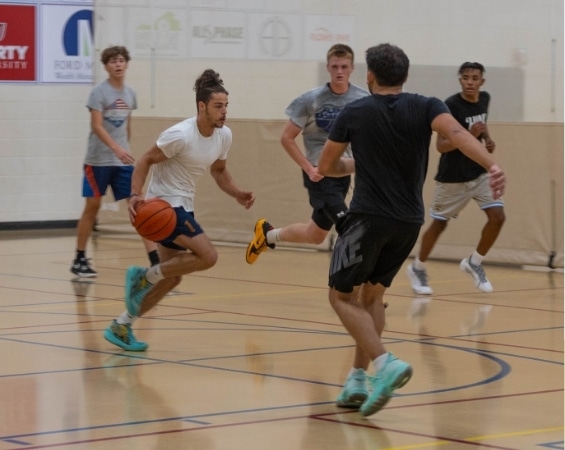 a group of men playing basketball