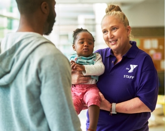 a woman holding a baby