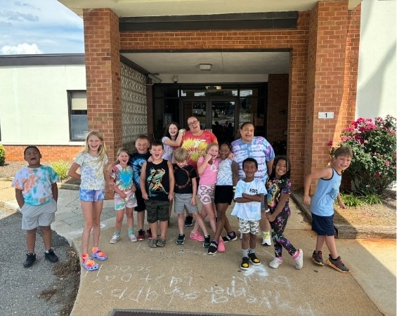a group of kids posing for a photo