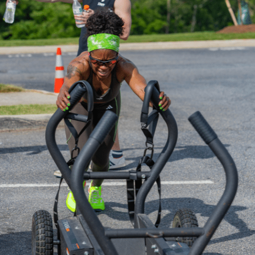 deka woman pushing sled